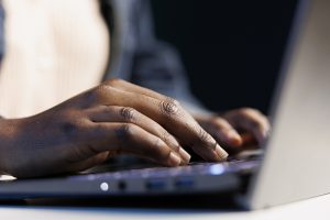Freelancer replying emails on laptop