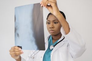 medium-shot-doctor-looking-radiography